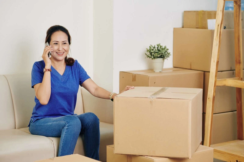 Woman packing boxes